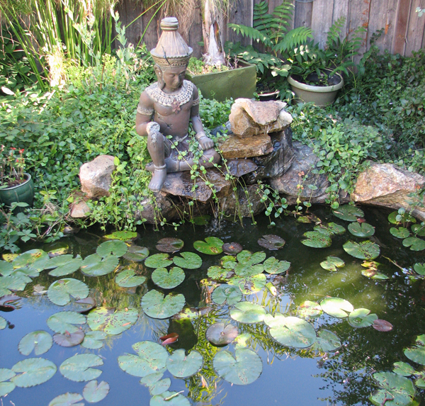 click to view larger image Lily pads and a buddha in a garden. 2011 Martinez Home Tour.