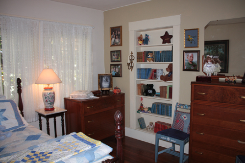 The bookcase is actually a secret door to another room. Martinez, CA.
